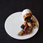 CEC Curry Masala Powder Flavour SN 1245-05-41 displayed as Indian whole spices including dried red chili, star anise, cinnamon, bay leaf, and fennel seeds spilling out from a ceramic jar onto a white marble plate