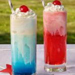 1-2 Taste IFF TRUSIL - American Icecream Soda - 030300 shown as refreshing cherry-flavored drinks topped with whipped cream and cherries, served in tall glasses