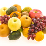 1-2 Taste CEC - Zingy Fresh Fragrance displayed as fresh fruits including apples, grapes, avocados, oranges, and pears arranged on a white background.