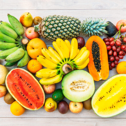 1-2 Taste IFF - Fruit Burst Fragrance displayed as colorful tropical medley with bananas, pineapples, papayas, melons, and grapes, perfect for vibrant