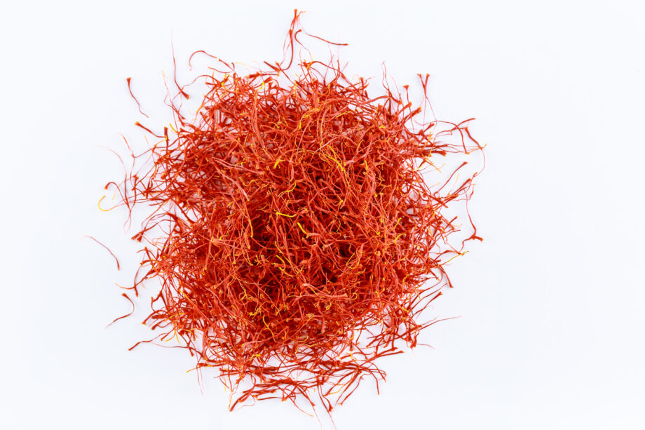stigmas of saffron isolated on white background. dried spice saffron threads Crocus