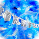 1-2 Taste IFF - Blue Comfort Fragrance displayed as clean white clothes drying on a line against a vibrant blue feathered background