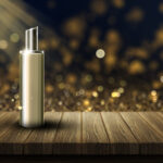 1-2 Taste IFF - Sun Bright Fresh Fragrance displayed in a sleek golden bottle on a wooden platform with sparkling golden bokeh background