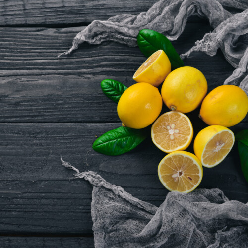 1-2 Taste IFF - Wonder Lemon Fragrance displayed as lemon on a wooden background