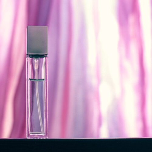 1-2 Taste IFF - Extreme Fresh Fragrance displayed in a sleek pink glass bottle with a metallic cap against a soft pink and white gradient background