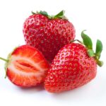 1-2 Taste Aroma INC - Natural Strawberry Flavour Liquid - O20202 shown as fresh whole and halved strawberries on a white background