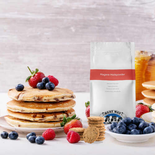 Best Way Ingredients - Skimmed Milk Powder Instant product pouch displayed with pancakes, berries, cookies, and honey on a rustic breakfast table