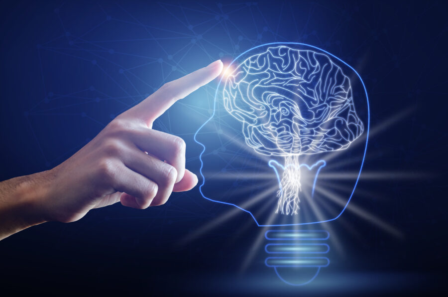 Light bulb with brain, finger of person touching on head brain and point connecting network on blue background. Creative The brain in the light bulb, The concept of the business idea.