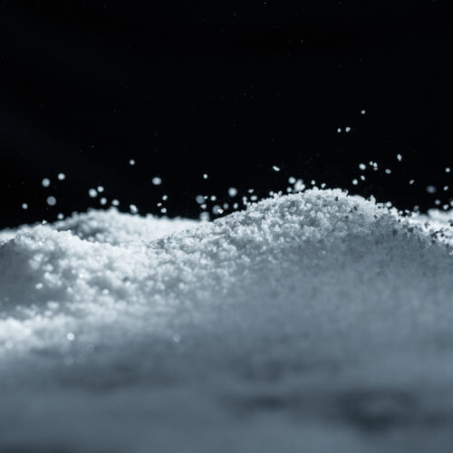 1-2 Taste Pure Health & Earth - Magnesium Chloride Crystals Food Grade as White Hygroscopic Flakes on Dark Background
