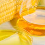 1-2 Taste FiberSMART Corn Syrup 90% in beaker beside fresh corn