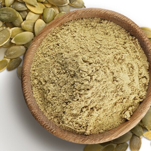 1-2 Taste ProteoSMART Pumpkin Protein Powder Organic in a wooden bowl