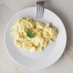 1-2 Taste Nexxus Foods - Innovegg - NX 4212 plant-based scrambled egg alternative on white plate with garnish