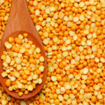 1-2 Taste Nexxus Foods - ProNex™ Organic Pea Protein 80 (100 mesh) - NXO 4258 yellow split peas on wooden spoon, clean-label plant protein source