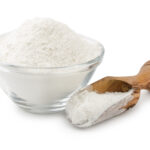 1-2 Taste Nexxus Foods - Bitter Masking System - NX 0611 powder in a glass bowl and wooden scoop