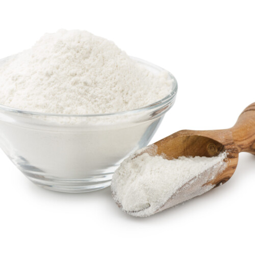 1-2 Taste Nexxus Foods - Bitter Masking System - NX 0611 powder in a glass bowl and wooden scoop