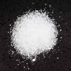 pile crystalline citric acid close up black scaled