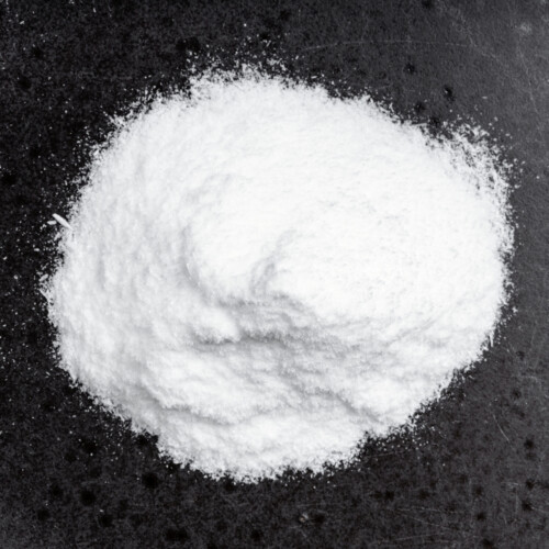 1-2 Taste Sayaji Industries Limited - Dextrose Monohydrate Food Grade shown as Fine White Powder on Black Background