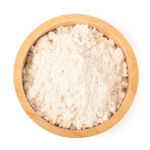 1-2 Taste Trigona - Whole Milk Powder displayed in a wooden bowl with creamy texture and fine granules
