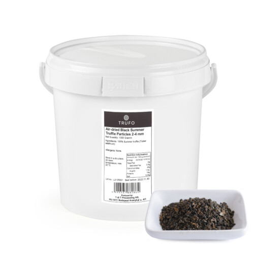 1-2 Taste Trufo - Airdried Summer Truffle 2-4mm packed in a white 1000g container with product label, shown with a sample of dried truffle flakes in a white dish