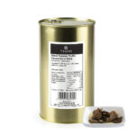 1-2 Taste Trufo - Black Summer Truffle Carpaccio in Brine packed in a gold tin with detailed label, accompanied by a white dish displaying thinly sliced truffle pieces in brine