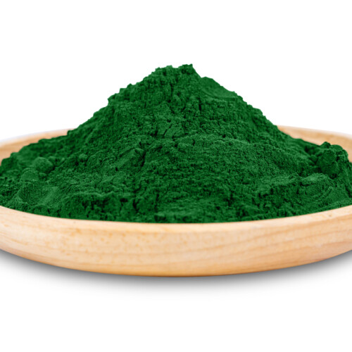 1-2 Taste Alpine Nutrition - Spirulina Powder (Organic) shown as pile of deep green powder placed on a light wooden plate