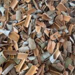 1-2 Taste Dace - Organic Broken Cassia shown as mixed-size cinnamon bark chips in natural brown tones spread out evenly