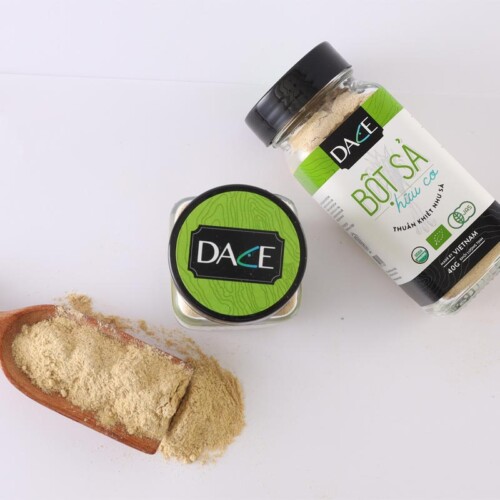 1-2 Taste Dace - Organic Lemongrass Powder shown in a glass jar and wooden spoon with light beige powder on white background