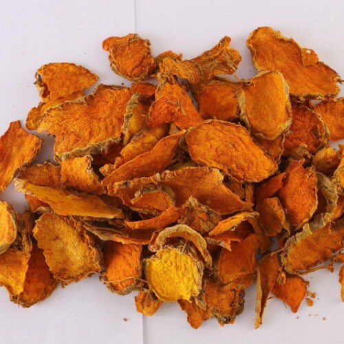 1-2 Taste Dace - Organic Sliced Turmeric displayed as a pile of vibrant orange organic sliced turmeric roots on a clean white surface