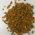 1-2 Taste Dace - Organic Turmeric TBC shown as finely chopped dried turmeric root on white background