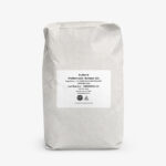 White kraft bag of NuTek Natural Ingredients - NuXtend (Cultured Skimmed Milk) - NuXtend 310 with printed label and product details