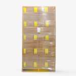 Pallet of Organic Lemon Myrtle Dried Leaf Fine Cut cartons shrink-wrapped with yellow shipping labels and packing list